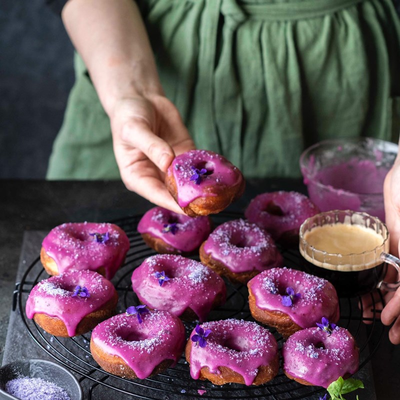 Donuts with blueberry glaze and homemade violet sugar