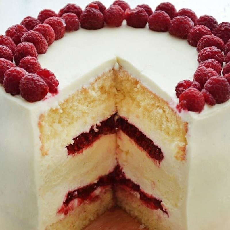 Exquisite cake with cotton cheesecake layer, raspberry & almonds