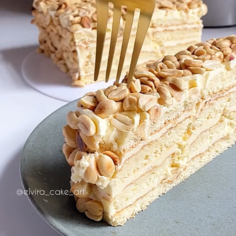 Moist cake with creamy frosting & peanuts