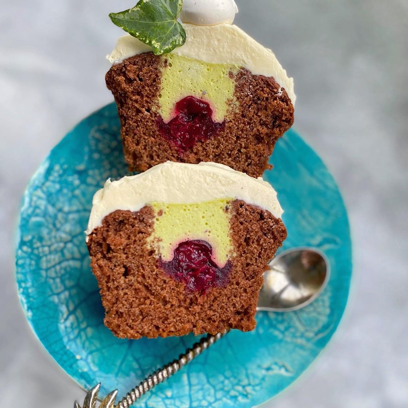 Chocolate muffins with pistachio mousse and berries