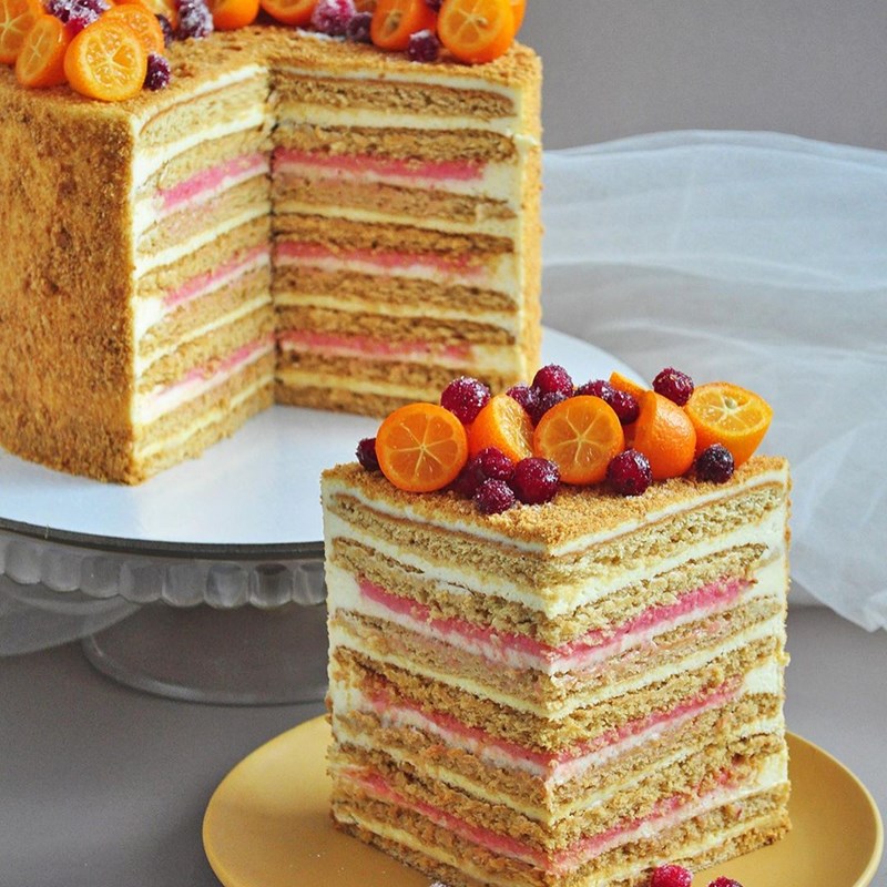 Honey cake with cranberry curd and orange cream