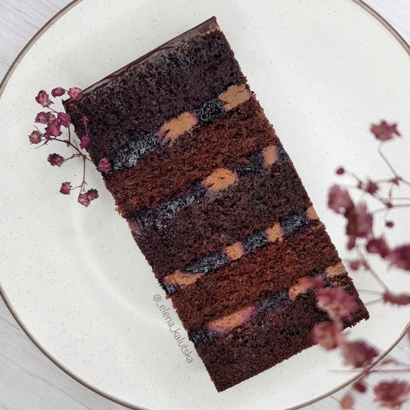Rich blackcurrant cake with two types of chocolate biscuit